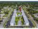 An aerial view showcasing this charming condominium complex in a desirable location, with community pool and shuffleboard courts at 4050 4Th N St # 116, St Petersburg, FL 33703