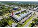 Community aerial view featuring a centrally-located pool, landscaping, and parking at 4050 4Th N St # 116, St Petersburg, FL 33703