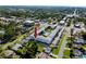 Aerial view of the condo complex with a pool in the center courtyard and ample parking at 4050 4Th N St # 116, St Petersburg, FL 33703