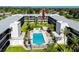 Aerial view of this condominium complex showing the community pool and immaculate landscaping at 4050 4Th N St # 116, St Petersburg, FL 33703