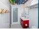 Sleek bathroom with a vibrant red vanity, contemporary fixtures, and glass-enclosed shower, designed for modern comfort and style at 4050 4Th N St # 116, St Petersburg, FL 33703