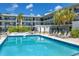 Enjoy the sparkling community pool and jacuzzi with tables and sun loungers at this condominium complex at 4050 4Th N St # 116, St Petersburg, FL 33703