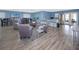 Community room with tables, chairs, kitchen, and luxury vinyl tile flooring at 4050 4Th N St # 116, St Petersburg, FL 33703
