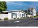 Attractive condo building with brick accents, lush landscaping, and well-maintained grounds at 4050 4Th N St # 116, St Petersburg, FL 33703