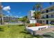 Exterior view of the condo buildings with access to amenities like the community pool at 4050 4Th N St # 116, St Petersburg, FL 33703