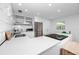 Bright kitchen features modern appliances, quartz countertops and sleek, white cabinetry at 4050 4Th N St # 116, St Petersburg, FL 33703