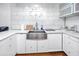 The kitchen features quartz counters, an undermount sink, and updated appliances at 4050 4Th N St # 116, St Petersburg, FL 33703