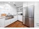 Updated kitchen with stainless steel appliances, sleek cabinets and a modern design at 4050 4Th N St # 116, St Petersburg, FL 33703