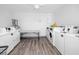 Laundry room featuring white appliances, tile floors and a folding table at 4050 4Th N St # 116, St Petersburg, FL 33703