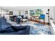 Spacious living room with a comfortable sofa, connecting to a modern kitchen, creating an open and inviting living space at 4050 4Th N St # 116, St Petersburg, FL 33703