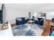 Cozy living room with comfortable seating, stylish rug and an open floor plan at 4050 4Th N St # 116, St Petersburg, FL 33703