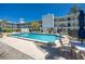 Beautiful pool area with lounge chairs available for relaxation and enjoying the Florida weather at 4050 4Th N St # 116, St Petersburg, FL 33703
