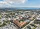 Aerial perspective showing the community's central pool, parking area, and colorful buildings at 410 S Armenia Ave # 926, Tampa, FL 33609