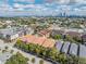 A captivating aerial view of a neighborhood with a city skyline in the background on a sunny day at 410 S Armenia Ave # 926, Tampa, FL 33609