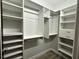 Walk-in closet offers ample storage with built-in shelving and rods for organization at 410 S Armenia Ave # 926, Tampa, FL 33609