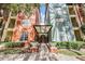 Inviting entrance shows a colorful building facade, well-maintained landscaping, and covered access at 410 S Armenia Ave # 926, Tampa, FL 33609
