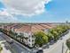 Exterior view showcasing well-maintained architecture, street parking, and mature landscaping at 410 S Armenia Ave # 926, Tampa, FL 33609