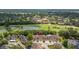 Aerial view of the community with a lake and golf course nearby at 4213 Arborwood Ln, Tampa, FL 33618