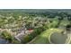Aerial view of property near golf course and pond in a mature community at 4213 Arborwood Ln, Tampa, FL 33618