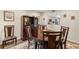 Charming dining area with a dark wood table set and views of the adjacent kitchen at 4213 Arborwood Ln, Tampa, FL 33618