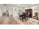 Cozy dining room with wood flooring, a round table, and a decorative rug at 4213 Arborwood Ln, Tampa, FL 33618