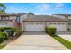 Charming townhome with a well-manicured front yard and an attached one-car garage at 4213 Arborwood Ln, Tampa, FL 33618