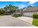 Inviting exterior with well-maintained landscaping and attached two-car garage in a beautiful neighborhood at 4213 Arborwood Ln, Tampa, FL 33618