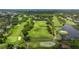 Wide aerial shot of a meticulously maintained golf course with water features at 4213 Arborwood Ln, Tampa, FL 33618