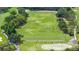 Panoramic view of a well-manicured golf course with lush greenery and mature trees at 4213 Arborwood Ln, Tampa, FL 33618