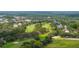 Aerial view of a scenic golf course winding through a residential area at 4213 Arborwood Ln, Tampa, FL 33618