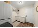 Functional laundry room featuring ample storage and modern appliances at 4213 Arborwood Ln, Tampa, FL 33618