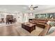 Inviting living room with a fireplace, wood floors, and a comfortable leather sofa, perfect for relaxation at 4213 Arborwood Ln, Tampa, FL 33618