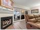 Living room with a fireplace, hardwood floors, and leather recliner and sectional sofa at 4213 Arborwood Ln, Tampa, FL 33618