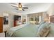 Comfortable main bedroom featuring a walk-in closet and balcony access at 4213 Arborwood Ln, Tampa, FL 33618