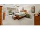 Spacious main bedroom with a private balcony and comfortable furnishings at 4213 Arborwood Ln, Tampa, FL 33618