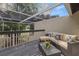 Cozy screened-in patio with comfortable seating and views of lush greenery and blue skies at 4213 Arborwood Ln, Tampa, FL 33618