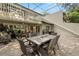 Relaxing screened patio with dining area, grill, and golf course views, perfect for outdoor entertaining and enjoying the beautiful scenery at 4213 Arborwood Ln, Tampa, FL 33618