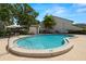 Community pool with 3-foot shallow end, seating, and convenient restroom facilities at 4213 Arborwood Ln, Tampa, FL 33618