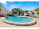 Inviting community pool with clear blue water, featuring a shallow end and ample space for swimming, perfect for relaxation and recreation at 4213 Arborwood Ln, Tampa, FL 33618