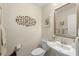 Stylish powder room with elegant fixtures and decorative wall art at 4213 Arborwood Ln, Tampa, FL 33618