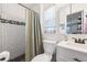 Bathroom featuring subway tile in the shower with a new vanity at 4521 S Cooper Pl, Tampa, FL 33611