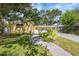 Charming single-story home with a well-manicured lawn and paved walkway to the front door at 4521 S Cooper Pl, Tampa, FL 33611