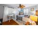 A light and airy bedroom with hardwood floors and a ceiling fan at 4521 S Cooper Pl, Tampa, FL 33611