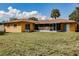Spacious backyard with green grass and home exterior view at 5004 S Hesperides St, Tampa, FL 33611