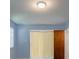 Bright bedroom with a sliding glass door and neutral decor at 5004 S Hesperides St, Tampa, FL 33611