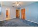 Carpeted bedroom featuring closet and an en suite at 5004 S Hesperides St, Tampa, FL 33611