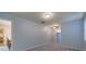Spacious bedroom with carpeted floors, ceiling fan, and ample natural light at 5004 S Hesperides St, Tampa, FL 33611