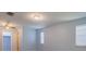 Well-lit bedroom featuring carpeted floors and large windows at 5004 S Hesperides St, Tampa, FL 33611
