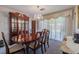Elegant dining room with a chandelier, a large wooden table, and classic decor for Gathering gatherings at 5004 S Hesperides St, Tampa, FL 33611