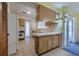 Bright kitchen with tiled floors, breakfast bar, and sliding doors to the outside at 5004 S Hesperides St, Tampa, FL 33611